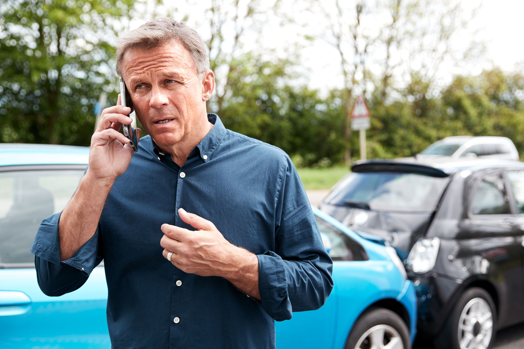 Mature Male Motorist Involved In Car Accident Calling Insurance Company Or Recovery Service; Shutterstock ID 1426529486; purchase_order: -; job: -; client: -; other: -